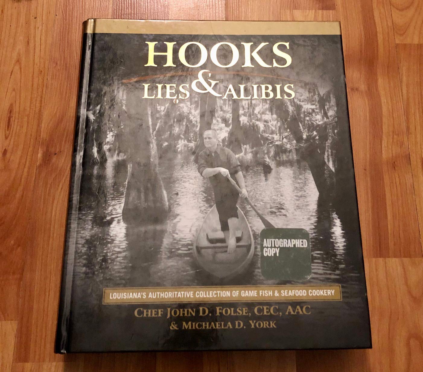 Hooks, Lies & Alibis: Louisiana's Authoritative Collection of Game Fish & Seafood Cookery by John D. Folse, Michaela York (2009) Hardcover used book depot