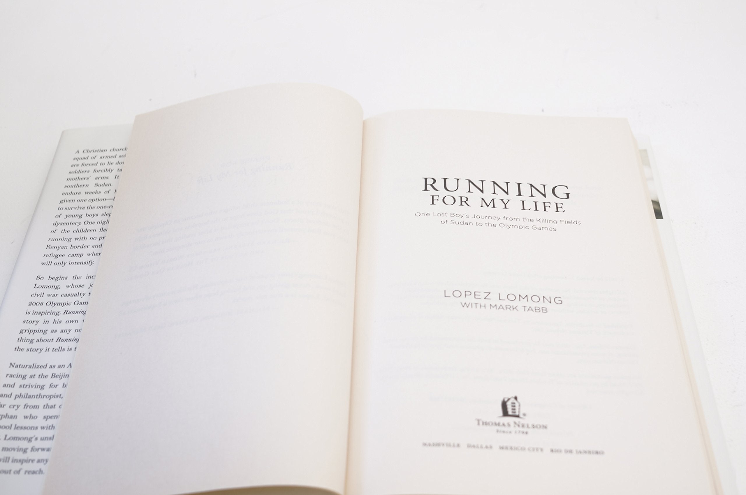 Running for My Life: One Lost Boy's Journey from the Killing Fields of Sudan to the Olympic Games used book depot