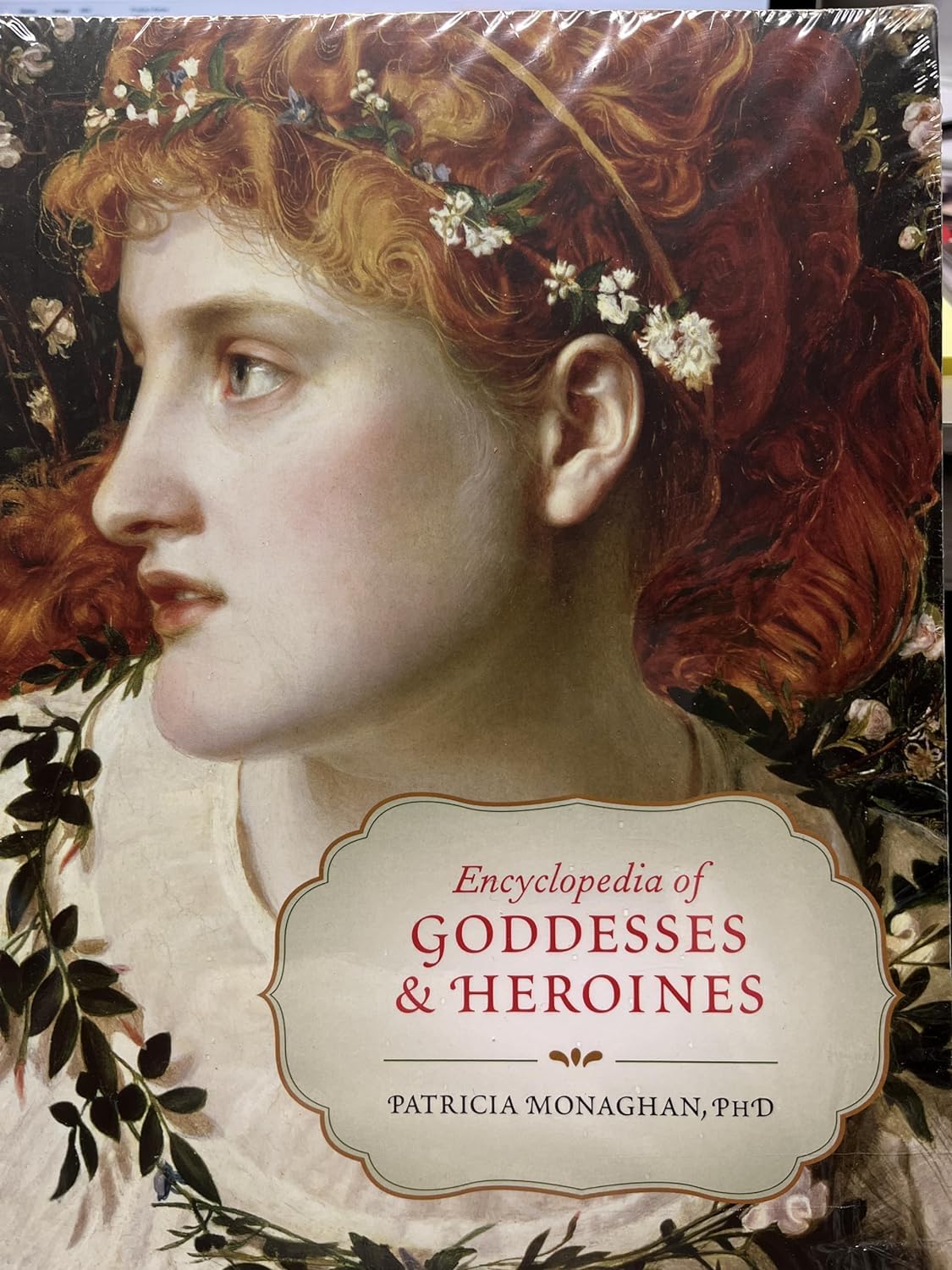 Cover of the Encyclopedia of Goddesses and Heroines by Patricia Monaghan featuring a goddess image.