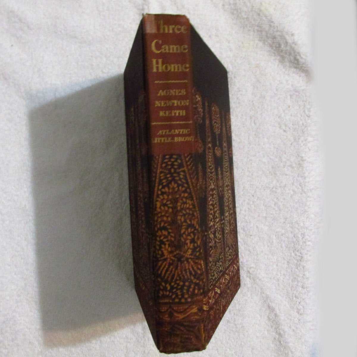Three Came Home used book depot