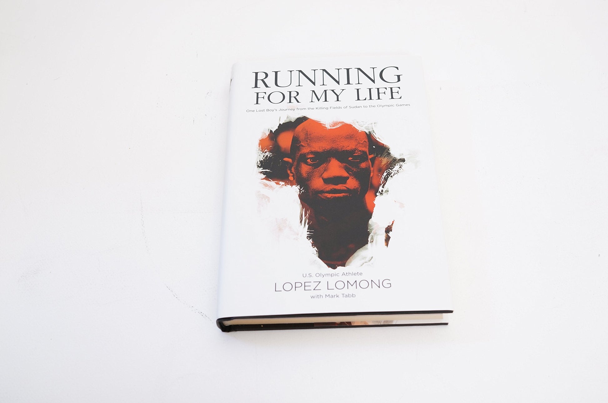 Running for My Life: One Lost Boy's Journey from the Killing Fields of Sudan to the Olympic Games used book depot