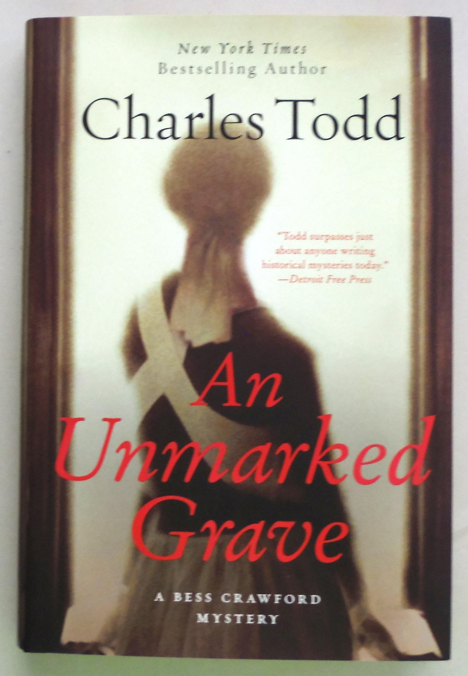 An Unmarked Grave (Bess Crawford Mystery) used book depot