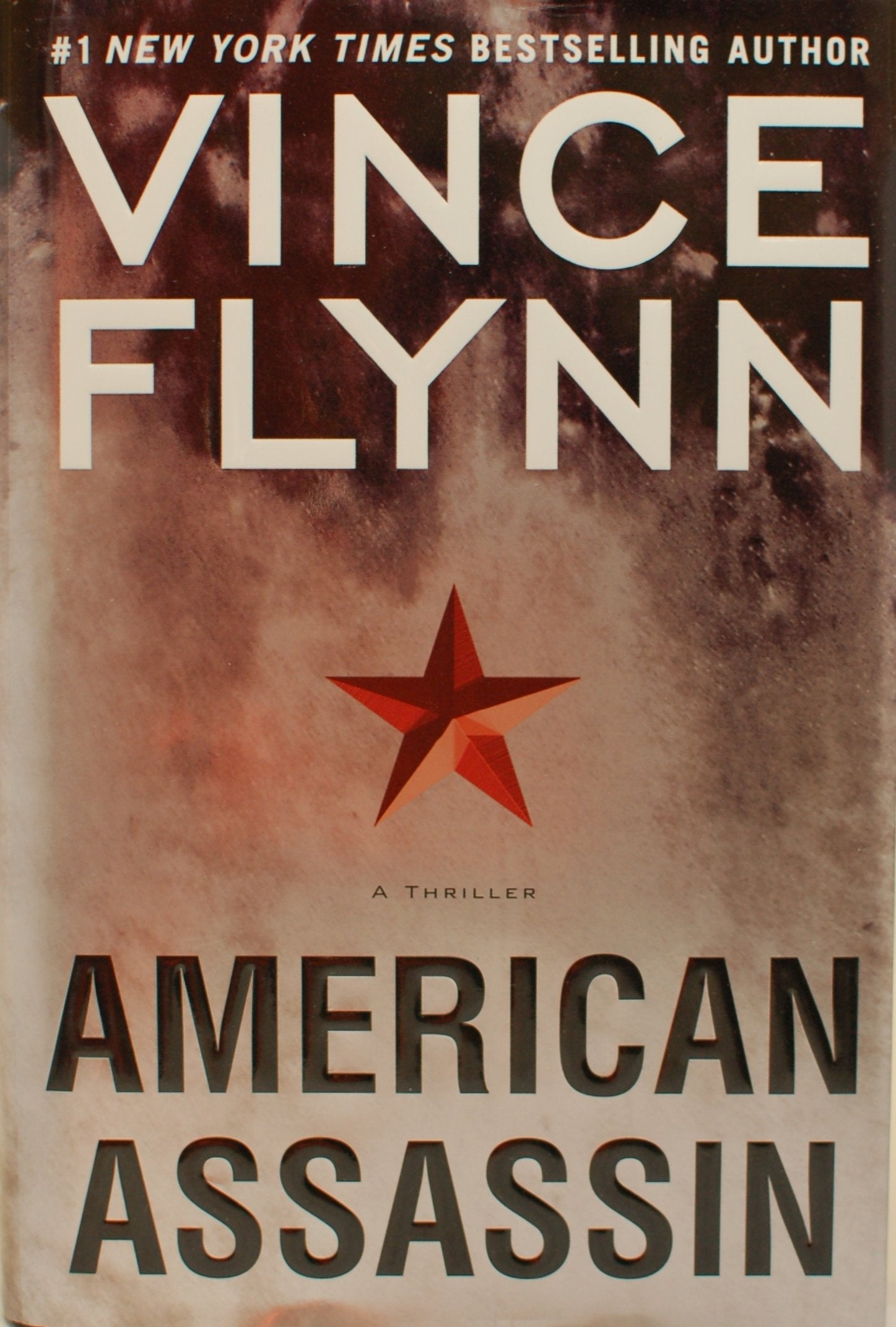 American Assassin: A Thriller (A Mitch Rapp Novel) used book depot