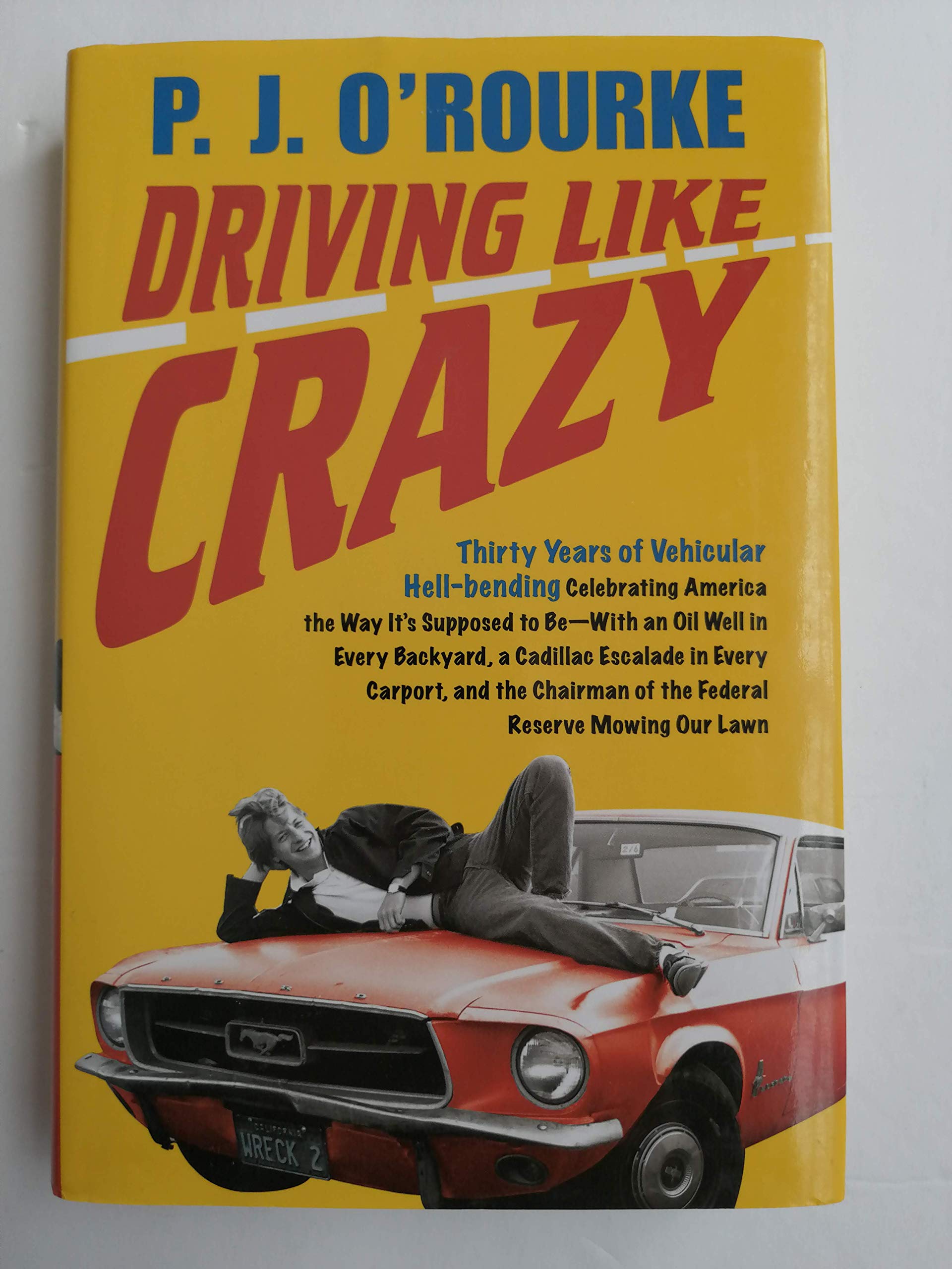 Driving Like Crazy: Thirty Years of Vehicular Hell-bending, Celebrating America the Way It's Supposed To Be -- With an Oil Well in Every Backyard, a ... of the Federal Reserve Mowing Our Lawn used book depot