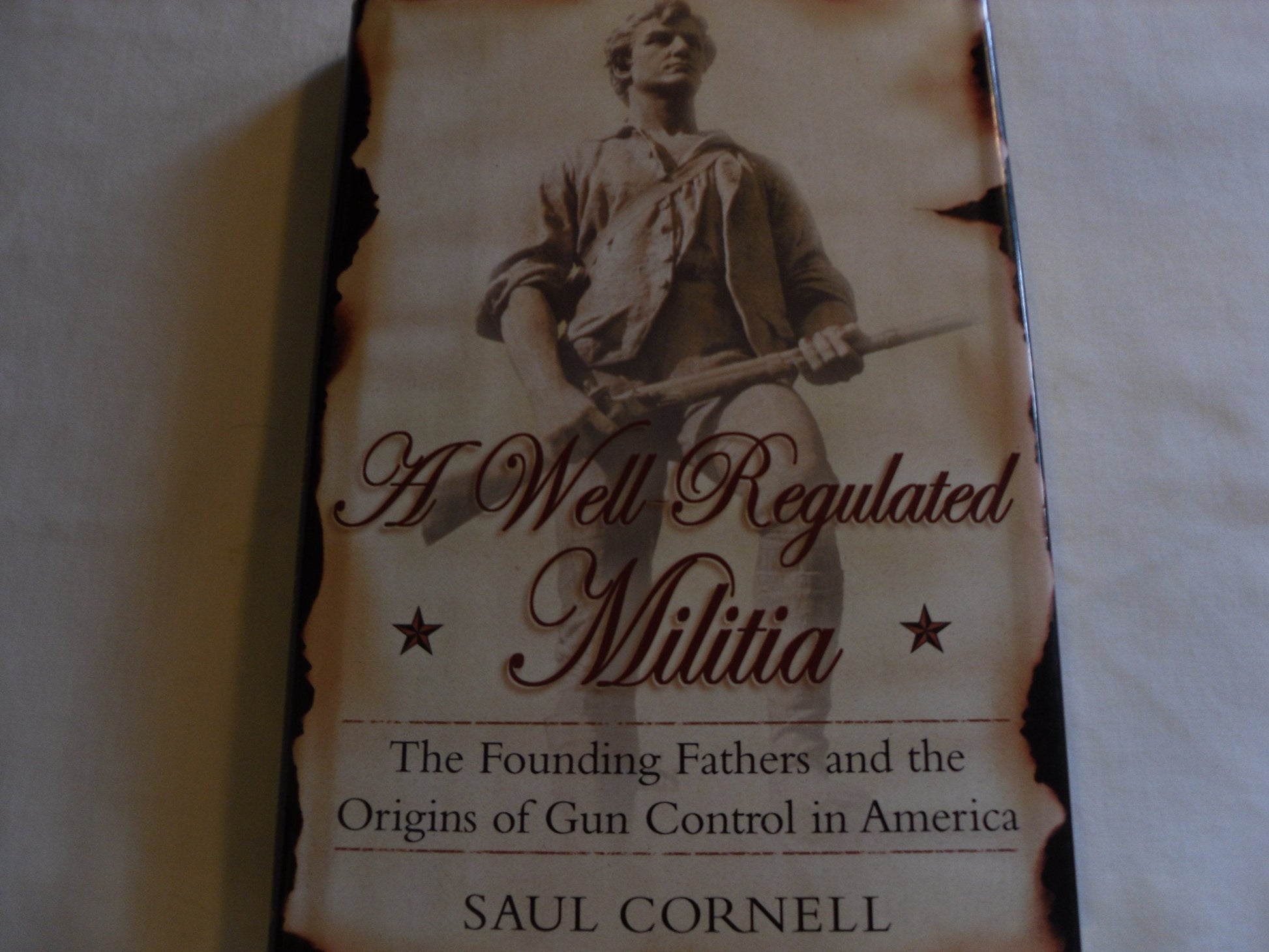 A Well-Regulated Militia: The Founding Fathers and the Origins of Gun Control in America used book depot