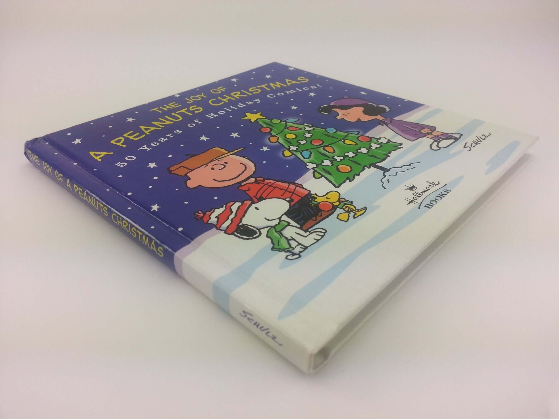 The Joy of a Peanuts Christmas: 50 Years of Holiday Comics! used book depot