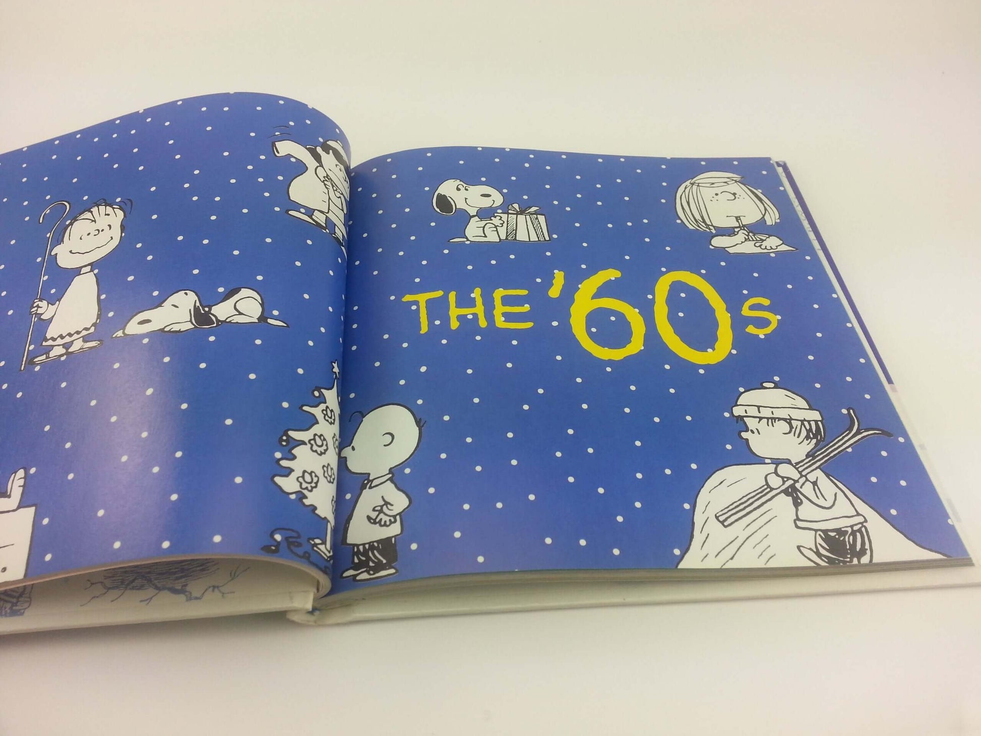 The Joy of a Peanuts Christmas: 50 Years of Holiday Comics! used book depot