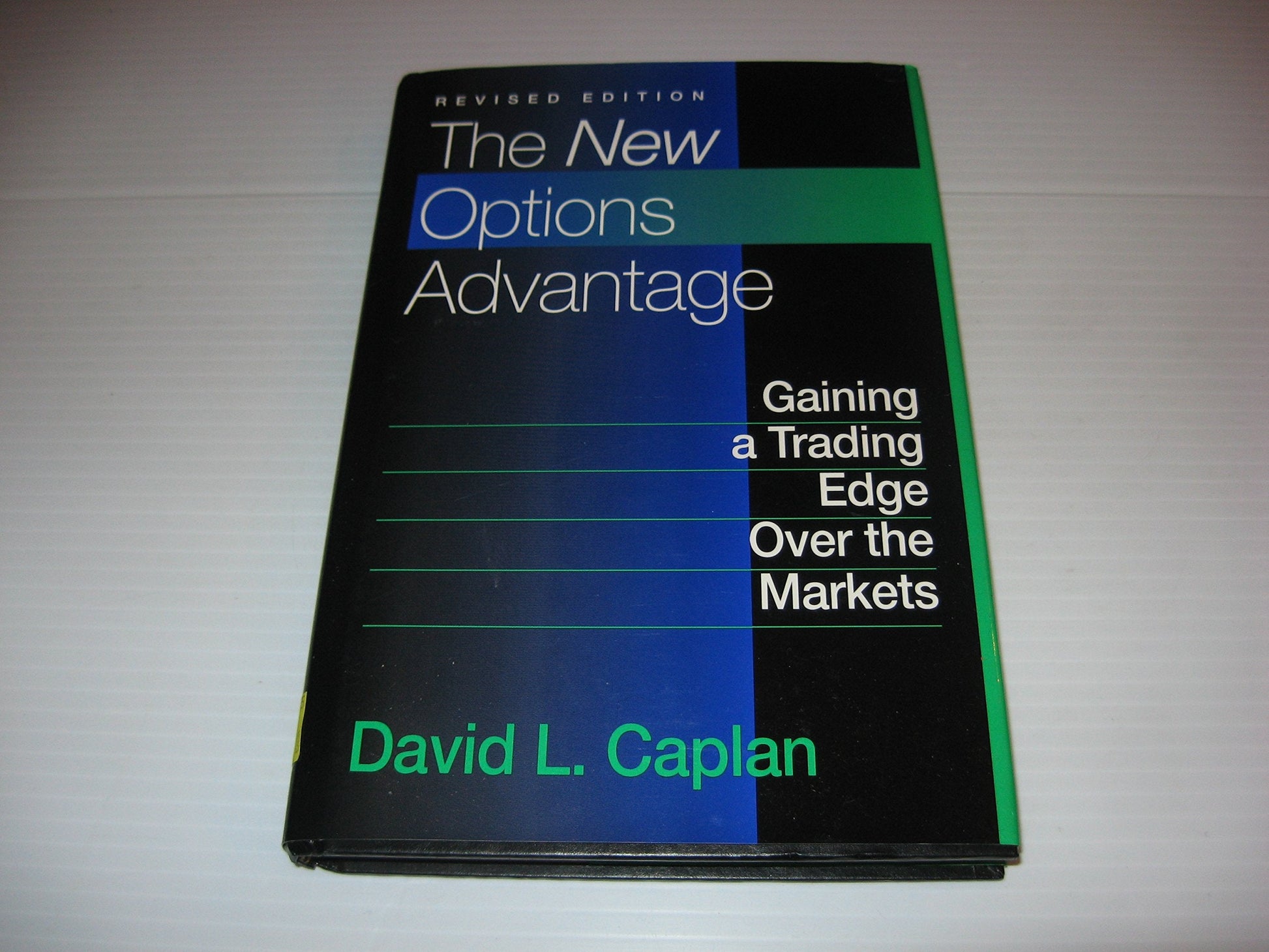 The New Options Advantage: Gaining a Trading Edge Over the Markets, Revised Edition used book depot