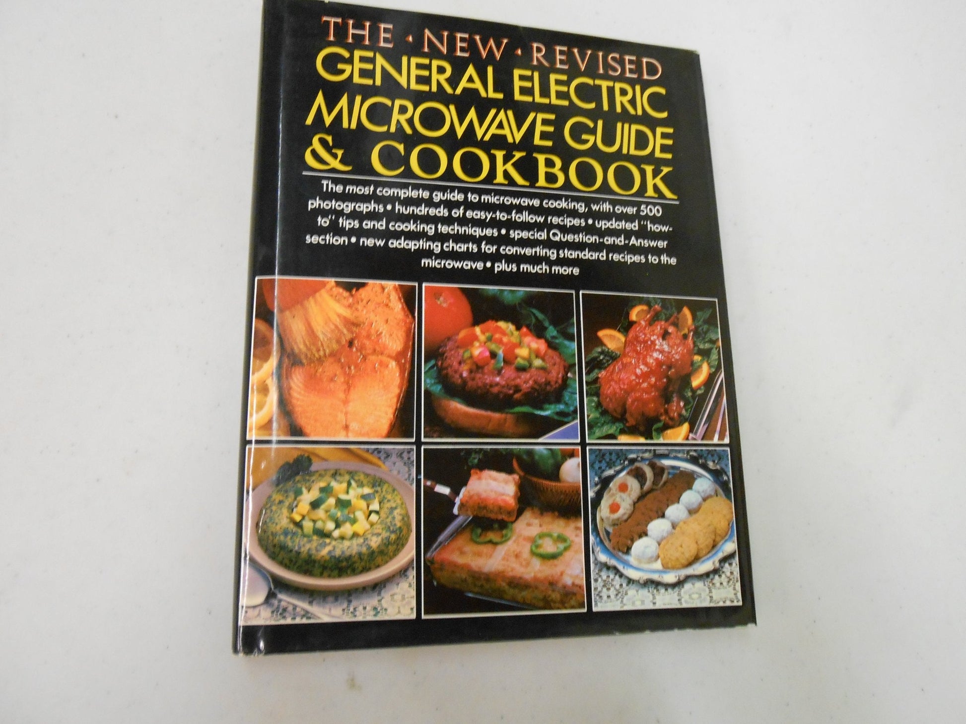 THE NEW REVISED GENERAL ELECTRIC MICROWAVE GUIDE & COOKBOOK used book depot